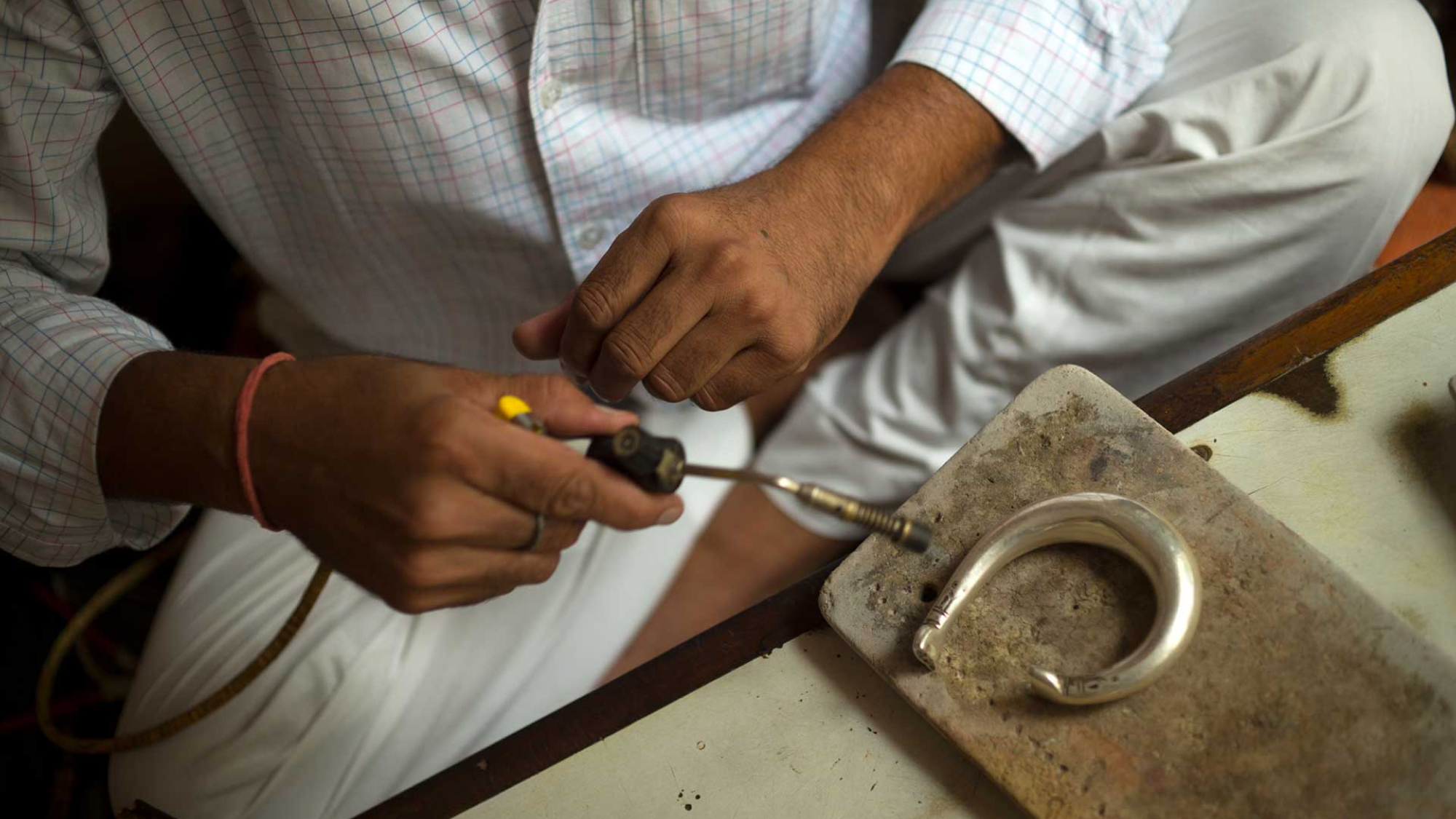 Person crafting with hand tools.