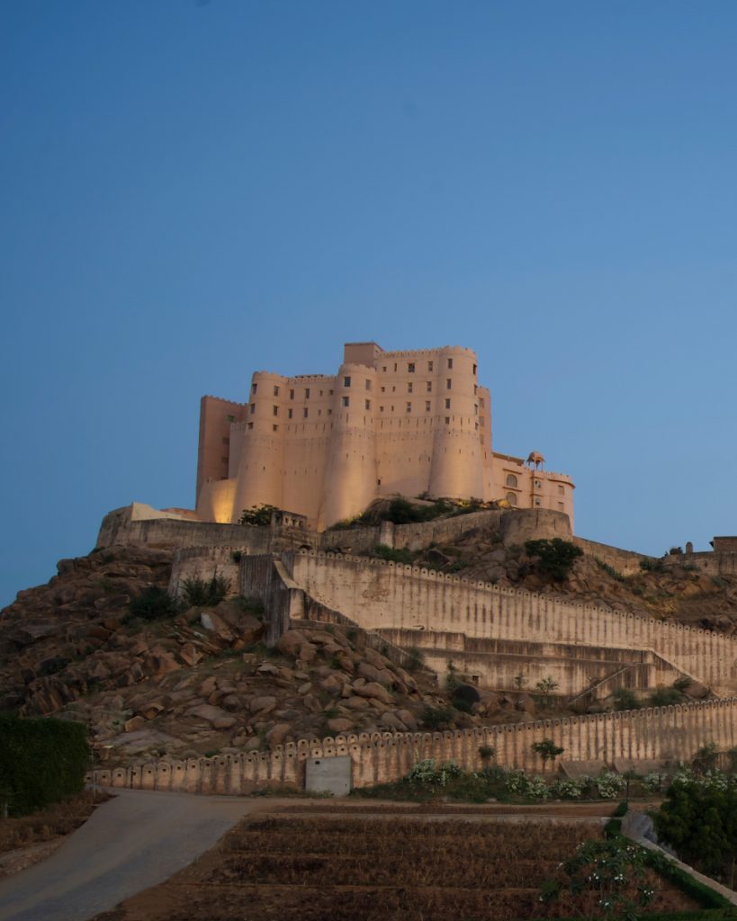 Hotel exterior atop a hill.