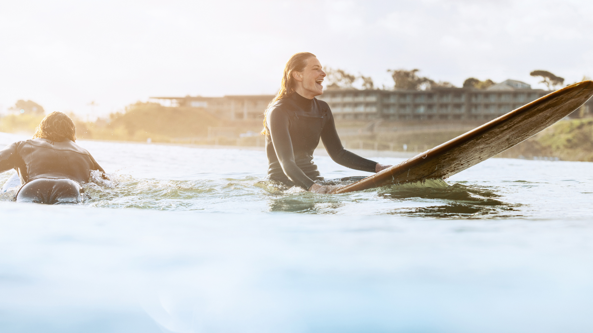 woman on a surfboard in the water