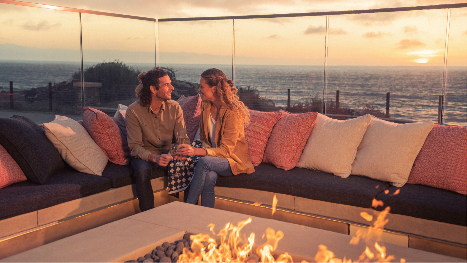 couple sitting by the fire pit