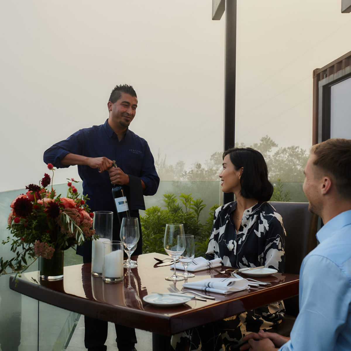 a sommelier serving wine