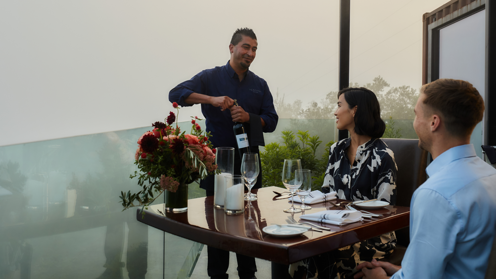 a sommelier serving wine