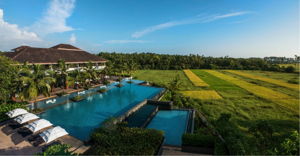 landscape view of hotel property and pool