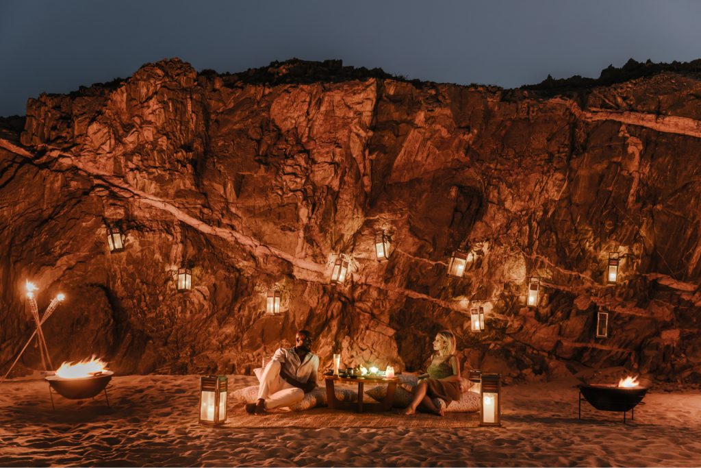 couple enjoying private dining at beach