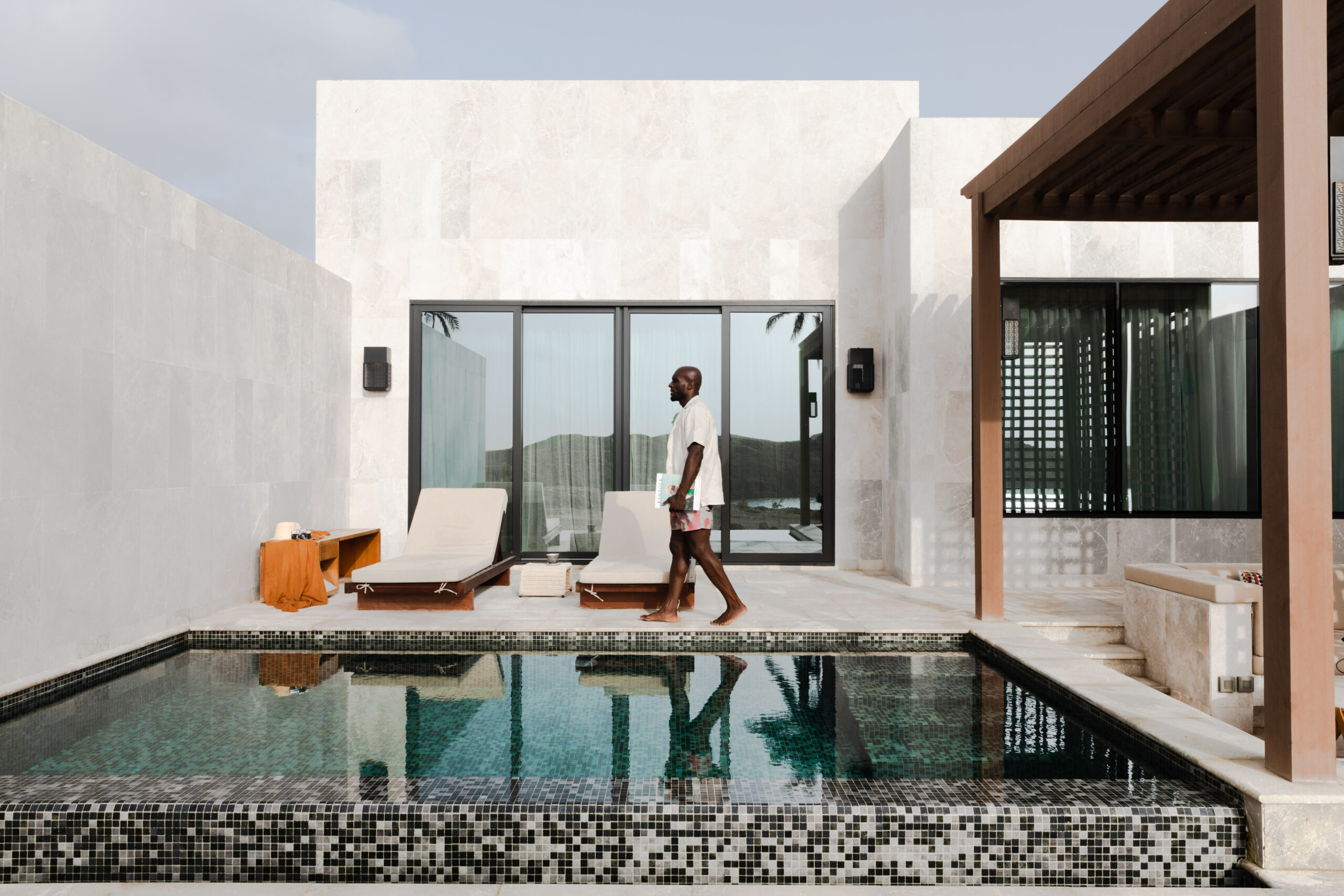 Man Walking Poolside