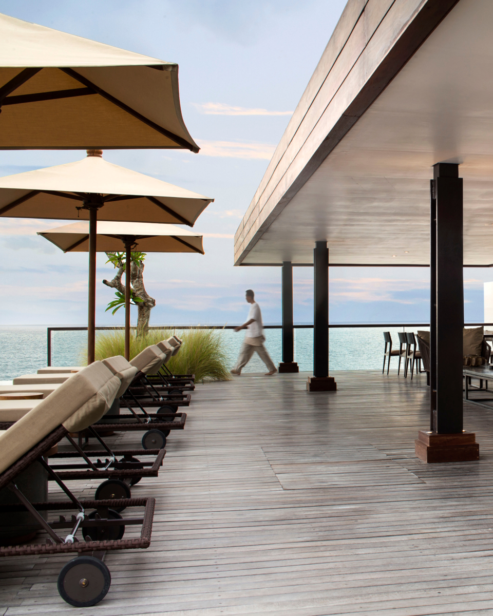 Lounge chairs and umbrellas outside