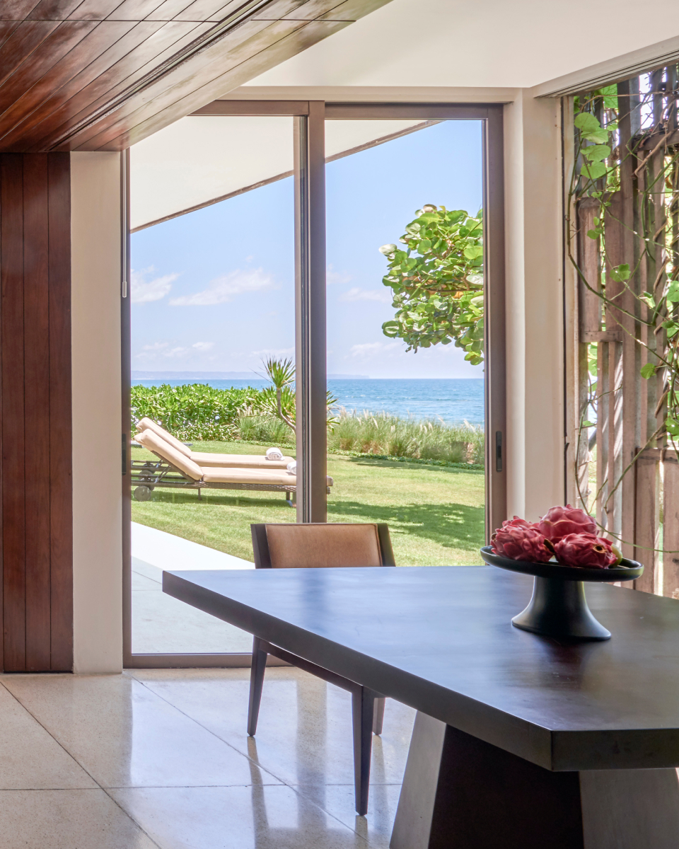 Table with backyard view and lounge chairs