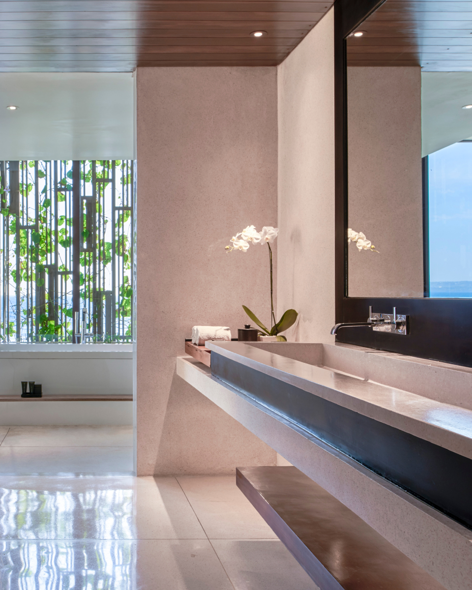 Long sink and mirror in bathroom