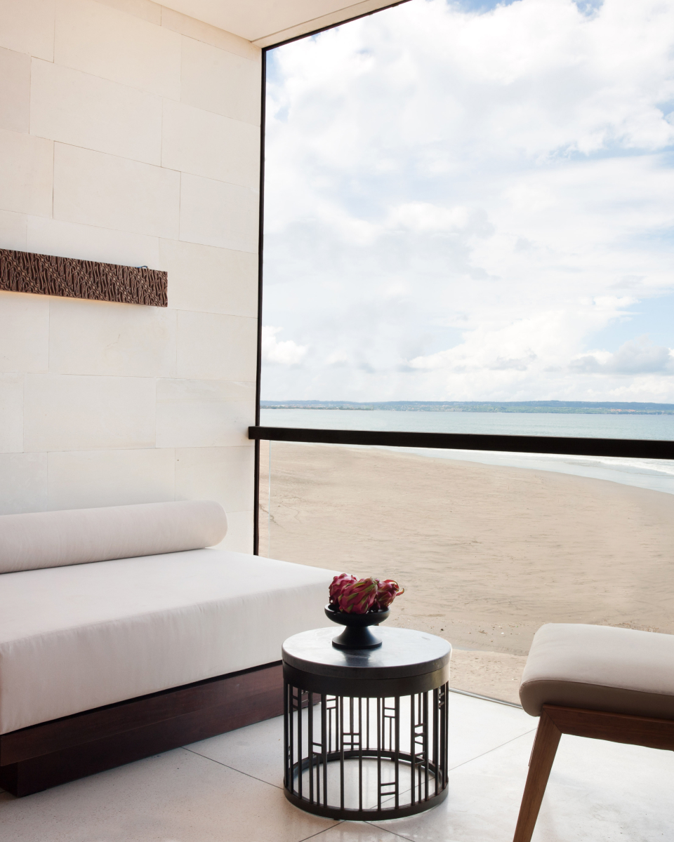 Cushioned white couch with an ocean view