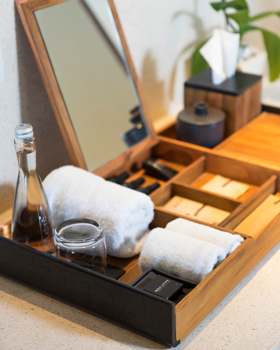 Wooden divider full of bath amenities