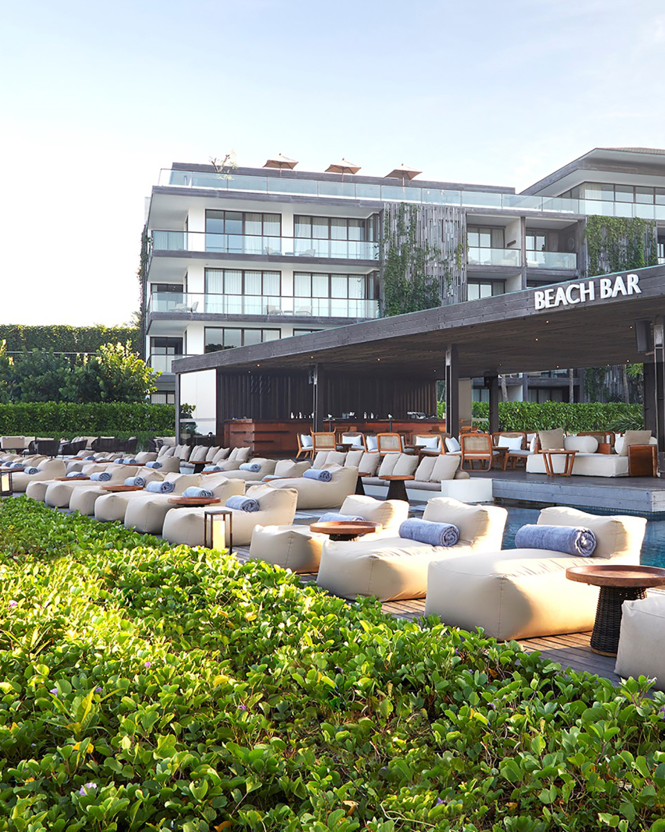 loungers near the pool bar