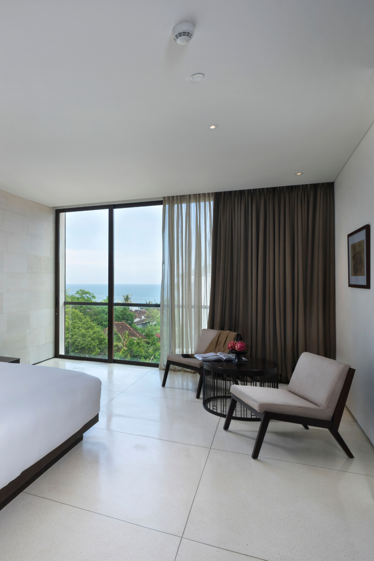 bedroom shot with balcony and ocean view