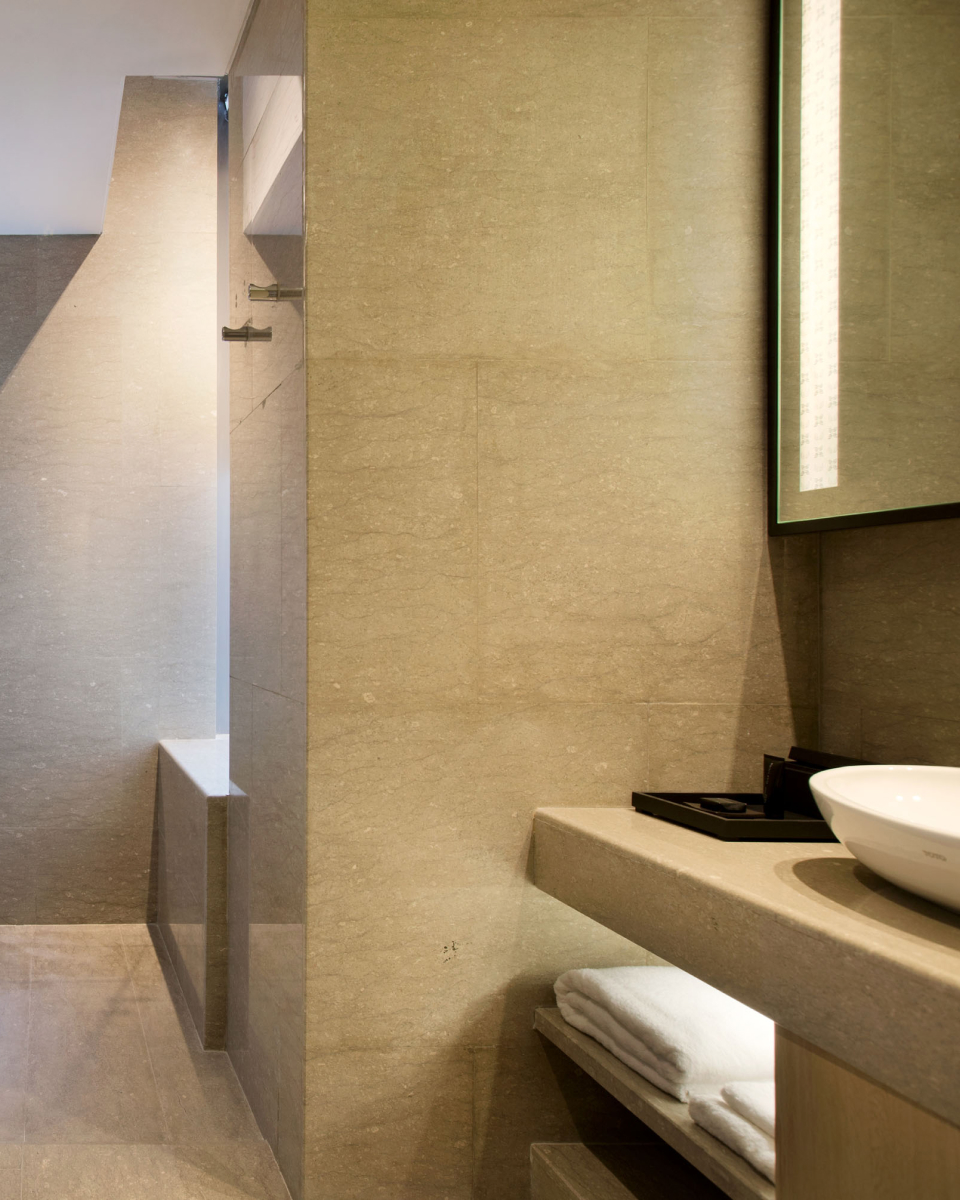 beige marble hotel room bathroom