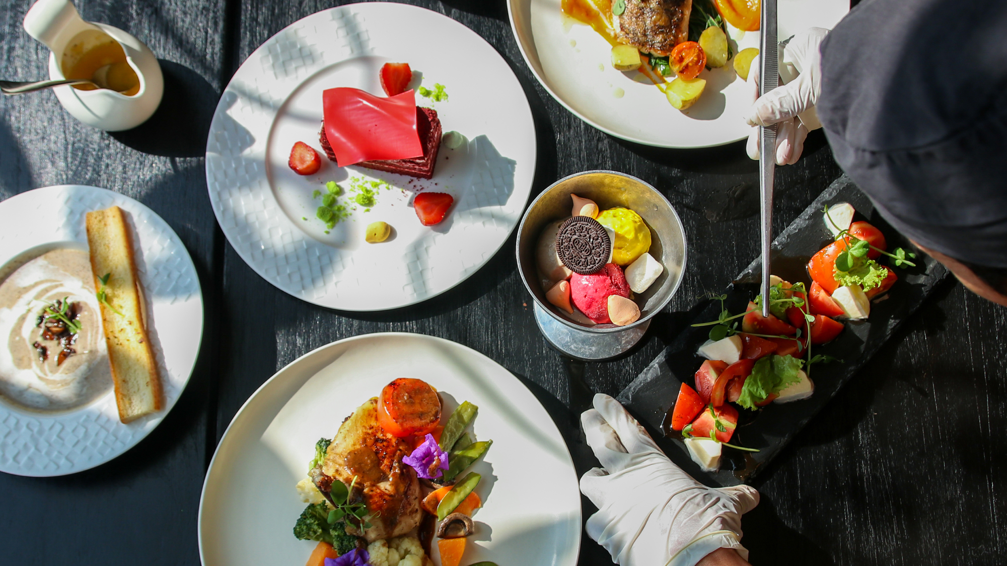 Shot of table from above with plated food.