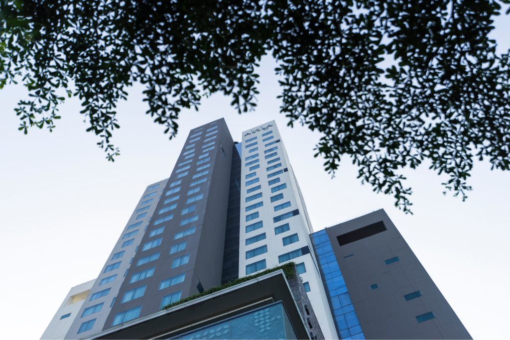 Shot of hotel looking up from the ground at daytime