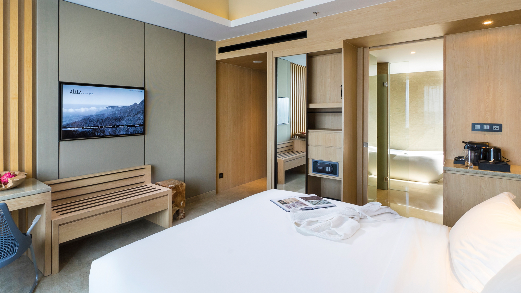 neutral hotel room with view of bathroom and entrance